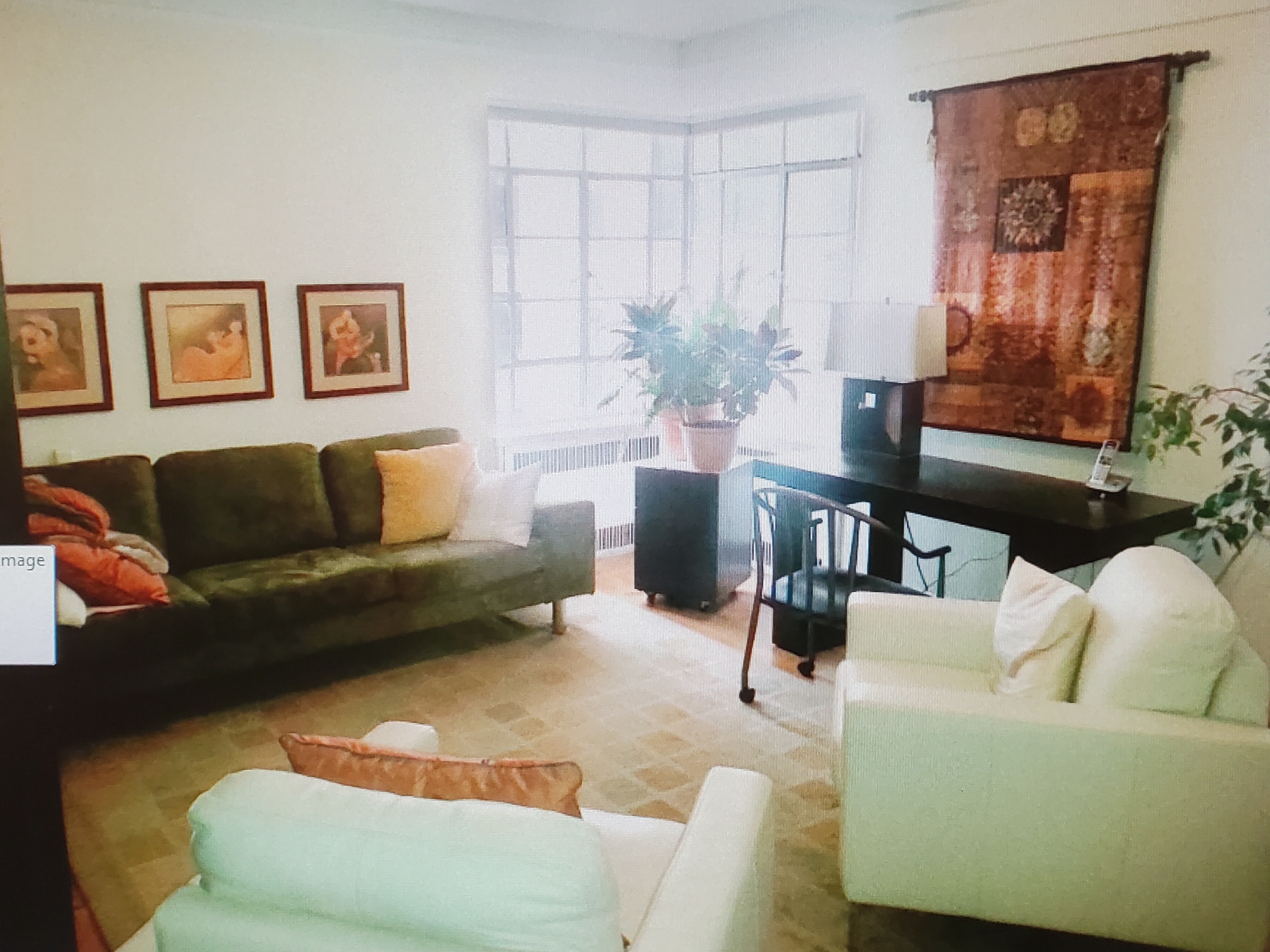 Therapist office with soft, natural lighting, and contemporary wooden furnishings.