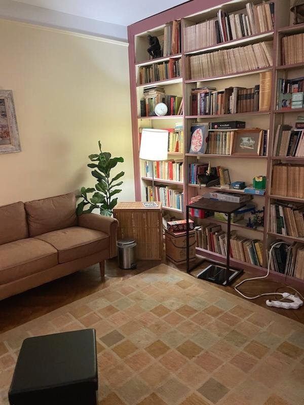 Therapist office with soft, natural lighting, and contemporary wooden furnishings.