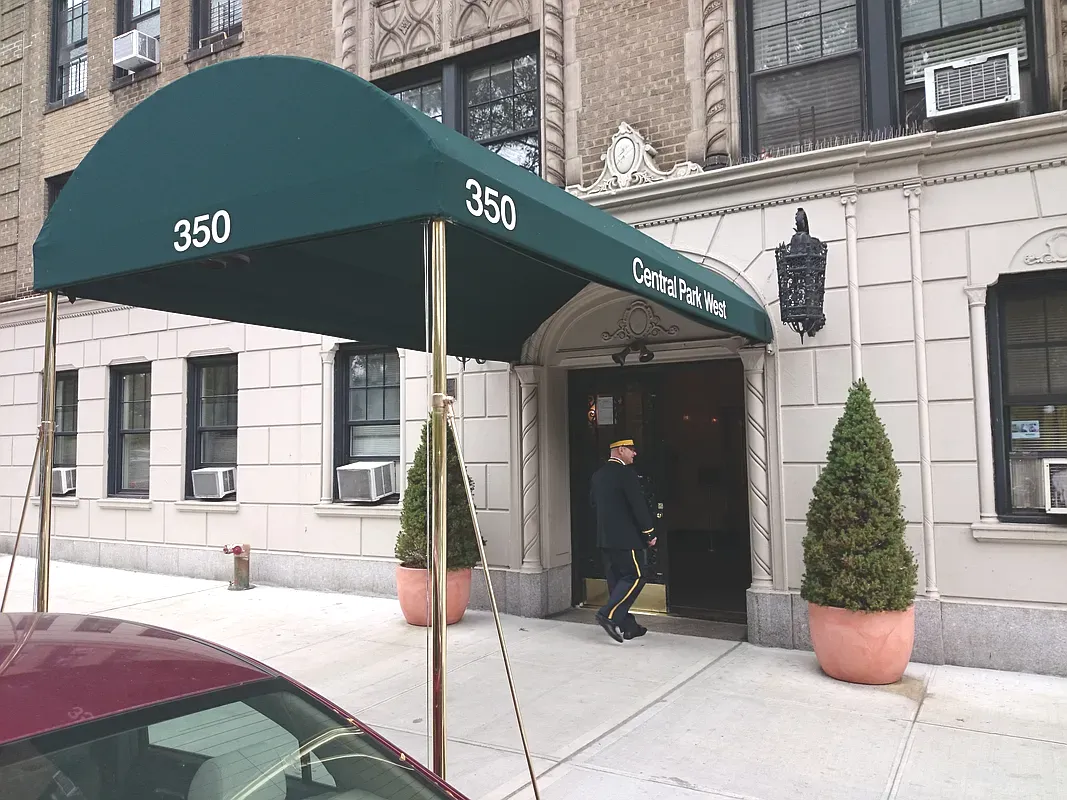 Comfortable living room with couch, rug, and artistic decor